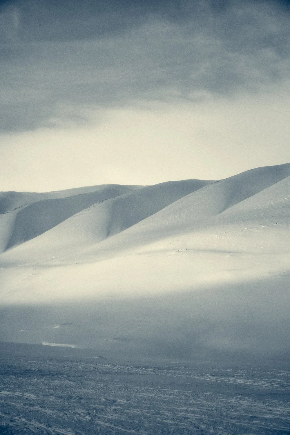 Soft, sculptural snow-covered hills in Svalbard